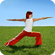 woman in red pants in a lunge position on a field